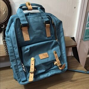Stylish Blue Backpack with Tan Accents